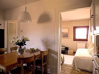The kitchen with its access to the living room
